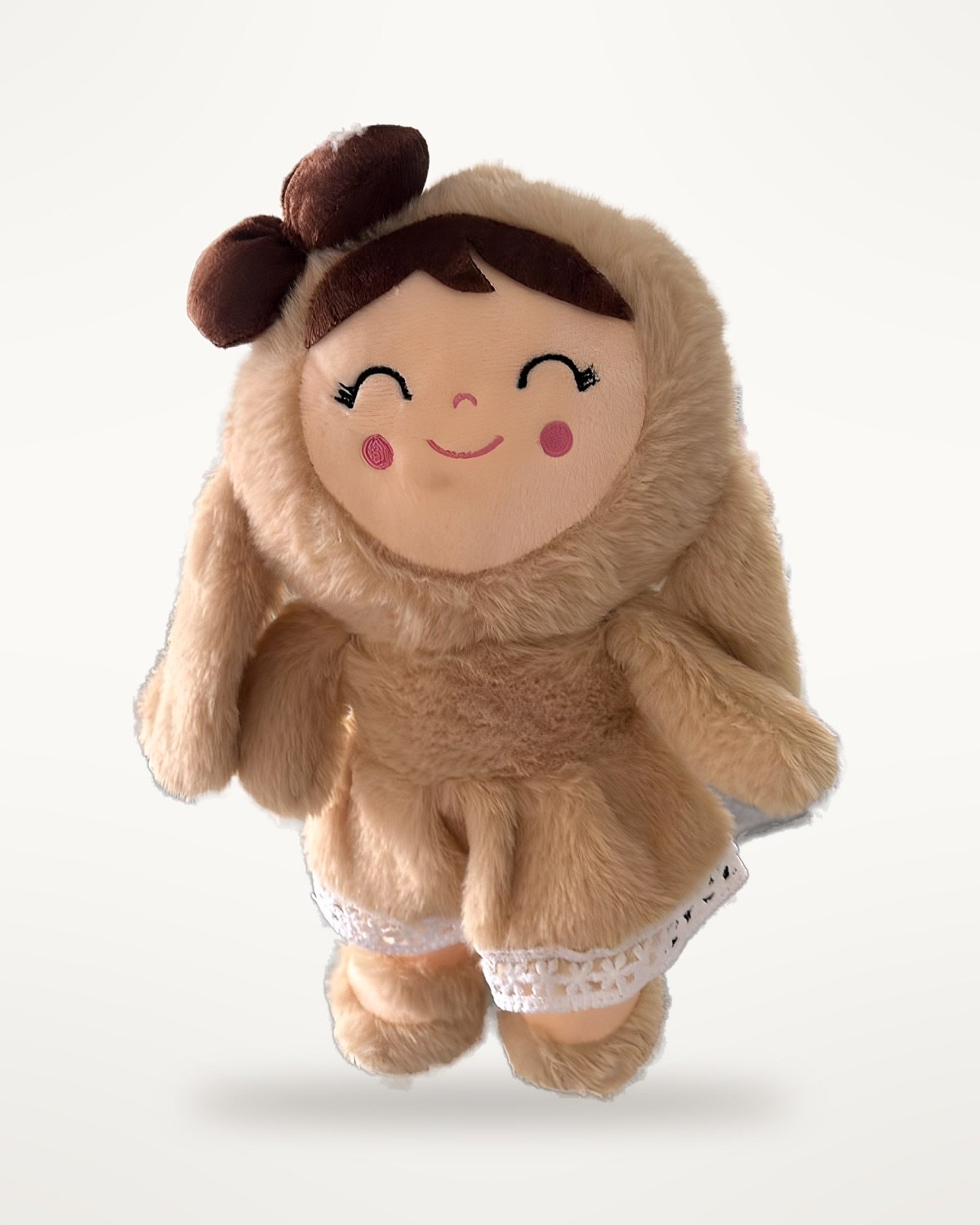 Plush girl doll sample with a brown bow and lace-trimmed dress