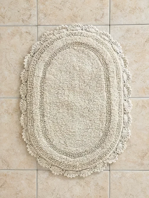 Oval white bath mat